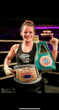 Sylvia Scharper with her boxing championship belts